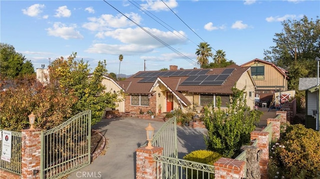 view of front of house featuring solar panels