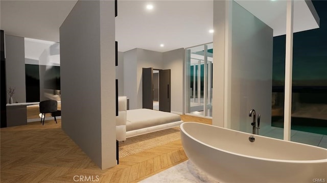 bathroom featuring a tub and parquet floors