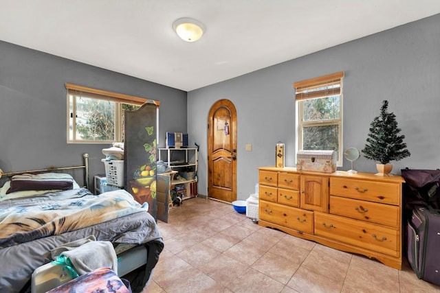 bedroom featuring multiple windows