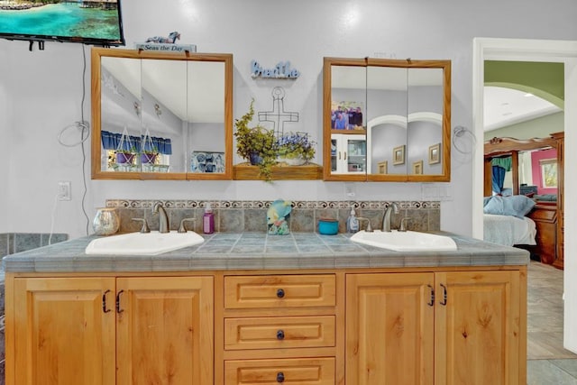 bathroom featuring tile patterned flooring and vanity