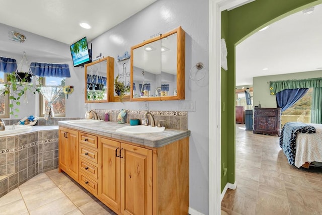 34667 Navajo Rd, Julian, CA 92036 - ensuite bathroom with double vanity, a relaxing tiled tub, and recessed lighting