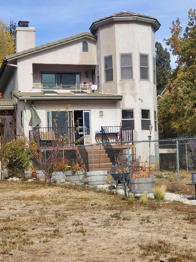 34667 Navajo Rd, Julian, CA 92036 - back of house featuring a chimney, stucco siding, and fence