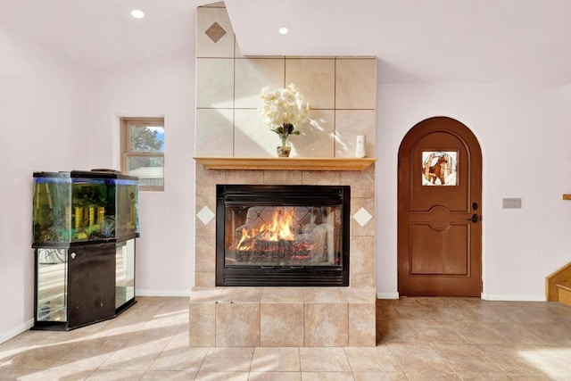 34667 Navajo Rd, Julian, CA 92036 - tiled entrance foyer featuring a tiled fireplace, baseboards, recessed lighting, and arched walkways