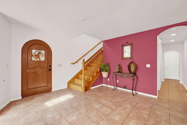 34667 Navajo Rd, Julian, CA 92036 - entryway with arched walkways, stairs, light tile patterned floors, recessed lighting, and baseboards