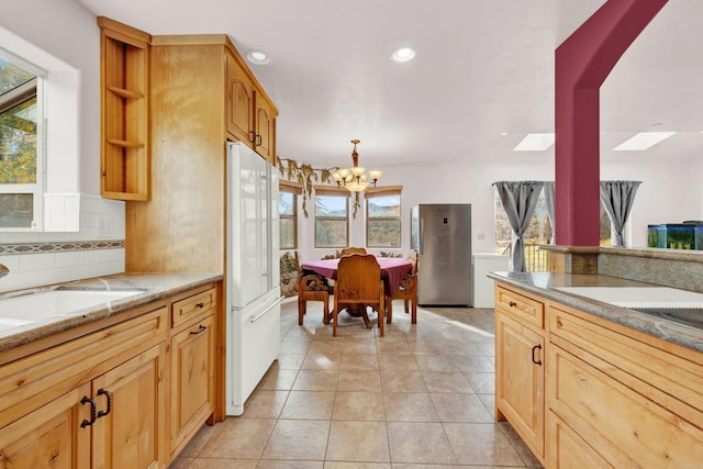 34667 Navajo Rd, Julian, CA 92036 - kitchen featuring white fridge, a chandelier, recessed lighting, decorative backsplash, and open shelves