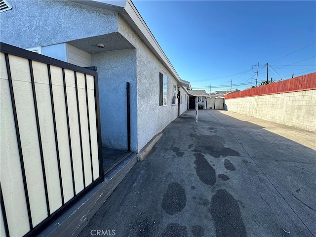 view of side of property with a patio area