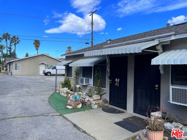 property entrance featuring cooling unit