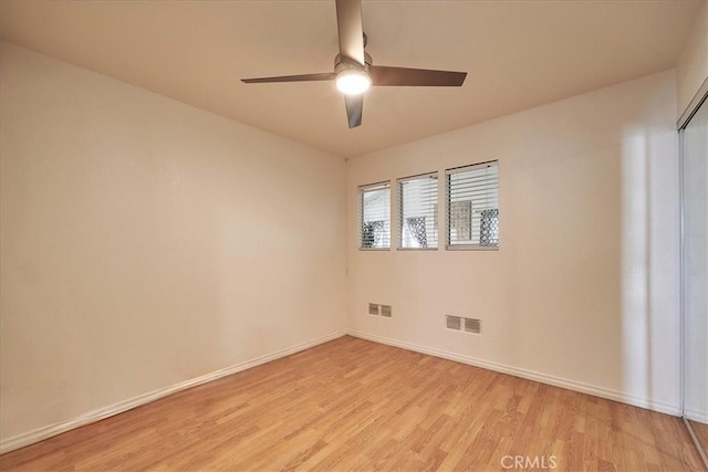 unfurnished room featuring ceiling fan and light wood-type flooring