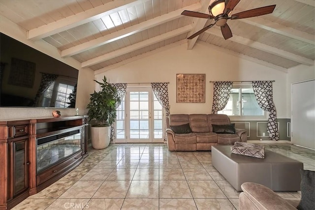 living room featuring ceiling fan, beamed ceiling, wooden ceiling, and high vaulted ceiling