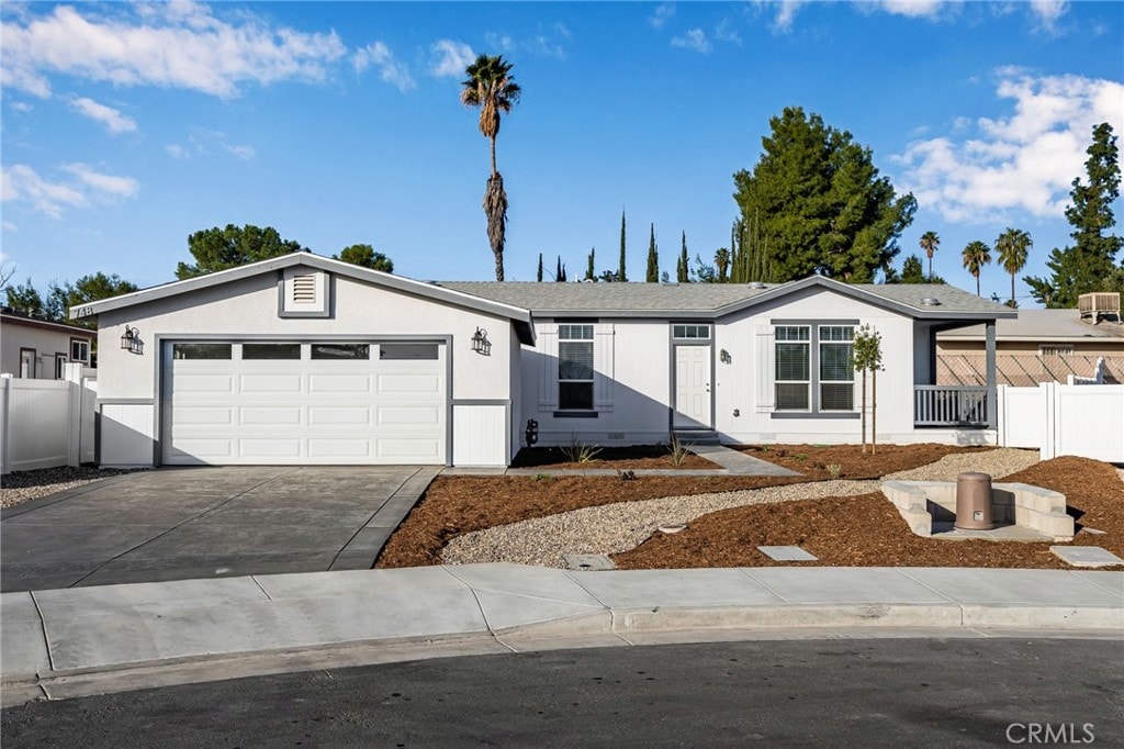 ranch-style house featuring a garage