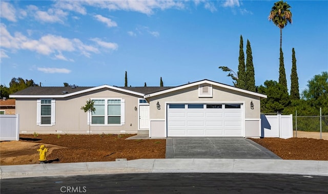 single story home featuring a garage