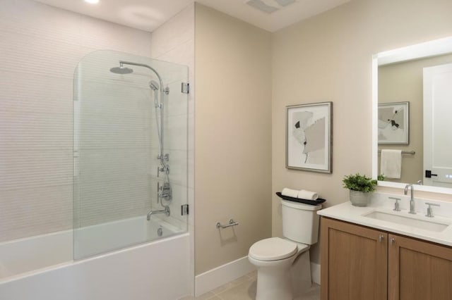 full bathroom featuring toilet, bath / shower combo with glass door, tile patterned flooring, and vanity