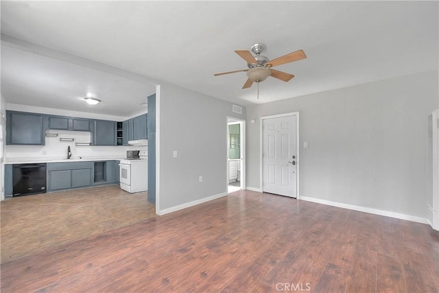 unfurnished living room with dark hardwood / wood-style floors, ceiling fan, and sink