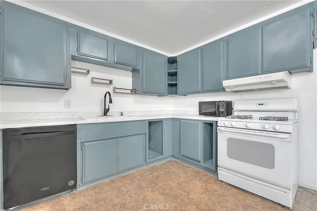 kitchen featuring black appliances, blue cabinetry, and sink