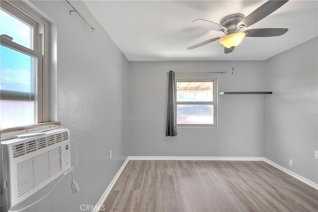 spare room with light hardwood / wood-style flooring and ceiling fan