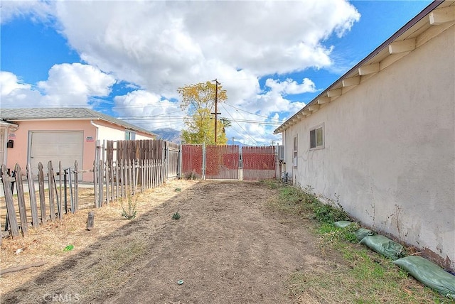 view of yard featuring a garage