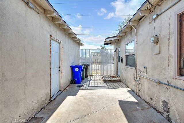 view of property exterior with a patio area