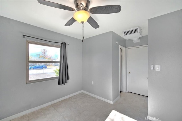 unfurnished room with ceiling fan