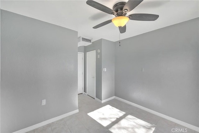 unfurnished bedroom with ceiling fan and light tile patterned floors