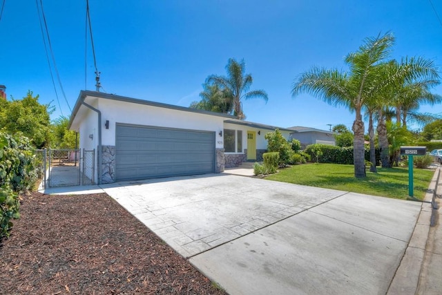 ranch-style home with a front yard and a garage