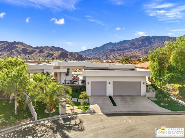 view of front of house featuring a mountain view and a garage