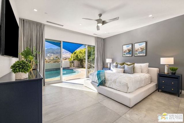 bedroom with access to outside, ceiling fan, and a mountain view