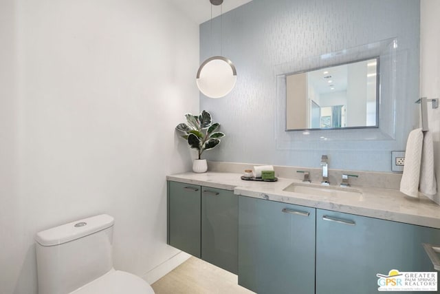 bathroom with vanity and toilet