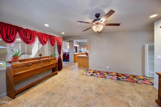 miscellaneous room with plenty of natural light and ceiling fan