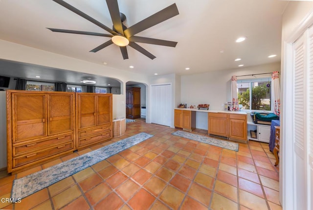 kitchen featuring ceiling fan and light tile patterned floors