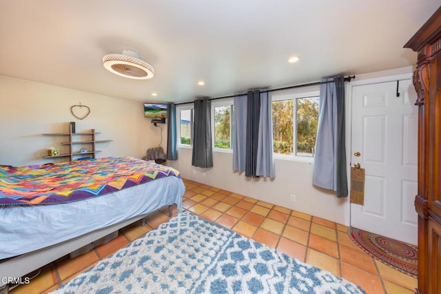 bedroom featuring light tile patterned floors