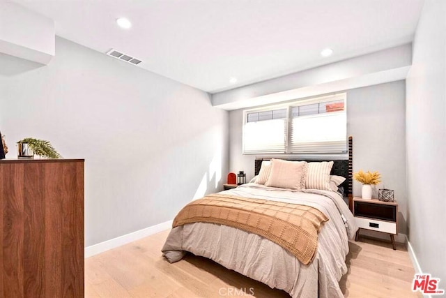 bedroom with light wood-type flooring