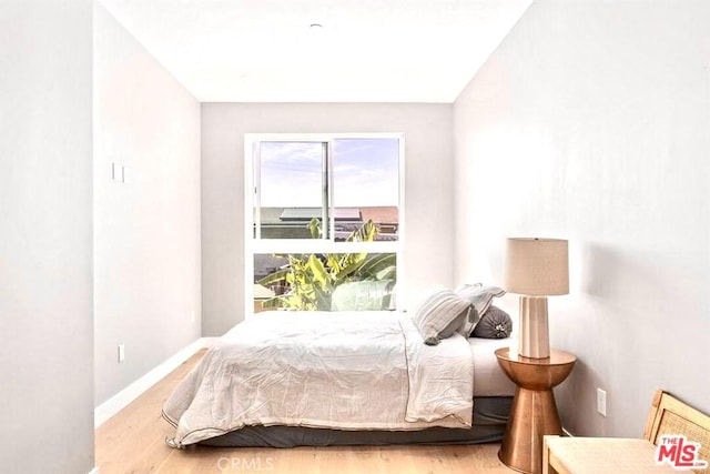 bedroom with light wood-type flooring