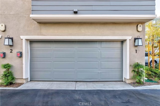 garage with driveway