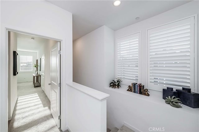 corridor with recessed lighting and light colored carpet