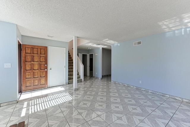 interior space with a textured ceiling