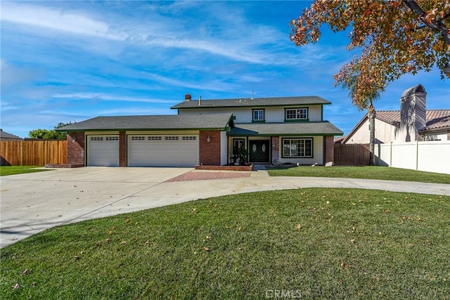 view of front facade with a garage and a front lawn