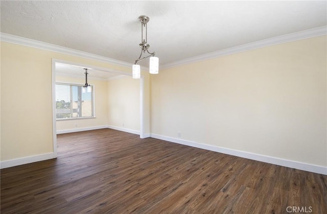 unfurnished dining area with ornamental molding and dark wood-type flooring