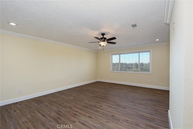 unfurnished room with a textured ceiling, ceiling fan, ornamental molding, and dark wood-type flooring