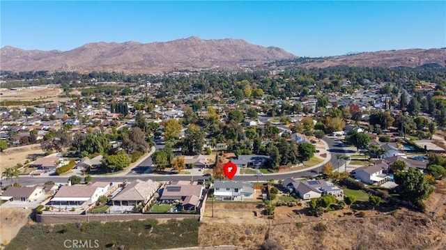 birds eye view of property featuring a mountain view