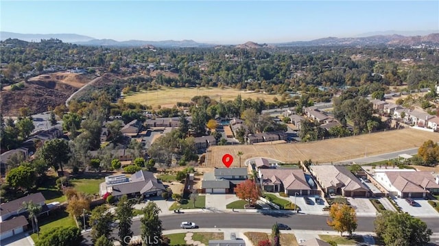 birds eye view of property with a mountain view