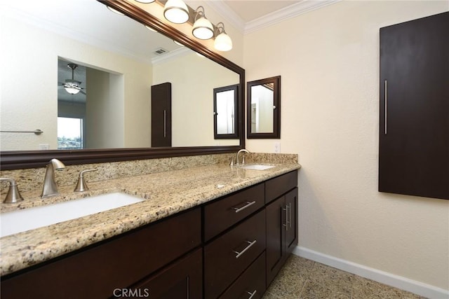 bathroom with vanity and ornamental molding