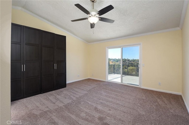 unfurnished bedroom with access to exterior, light carpet, crown molding, and lofted ceiling