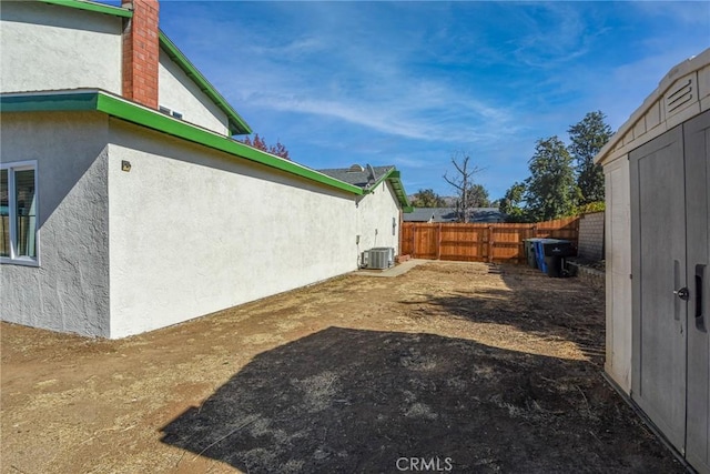 view of yard with central AC