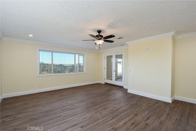 unfurnished room featuring crown molding, ceiling fan, dark wood-type flooring, and a textured ceiling