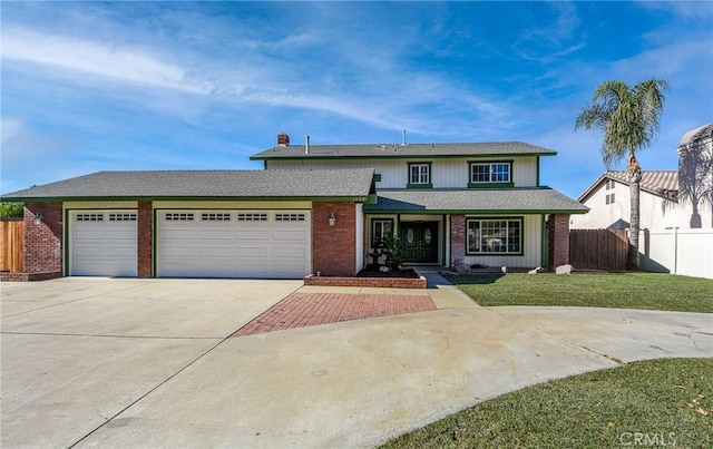 front facade with a front lawn and a garage