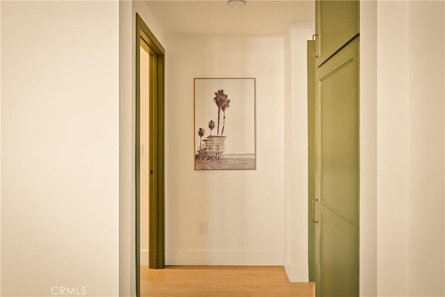 hallway with hardwood / wood-style floors