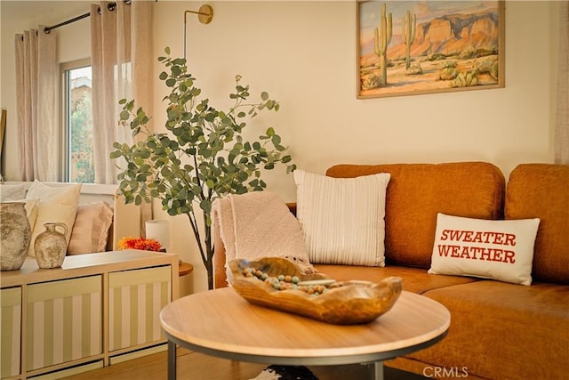 sitting room with hardwood / wood-style flooring