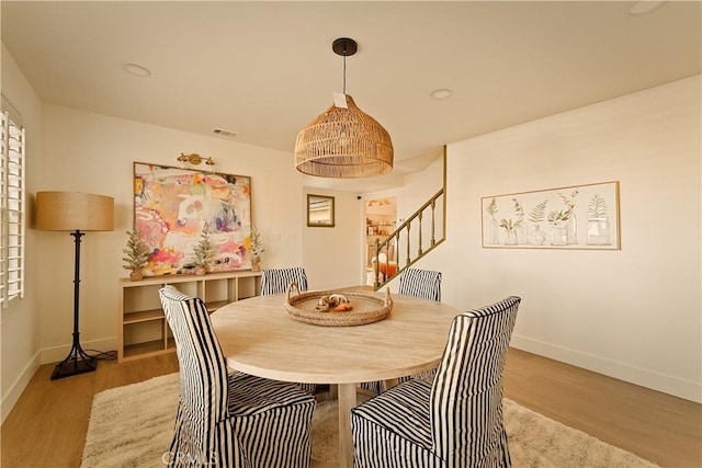 dining area with light hardwood / wood-style flooring