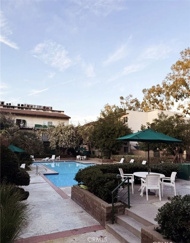 view of pool with a patio