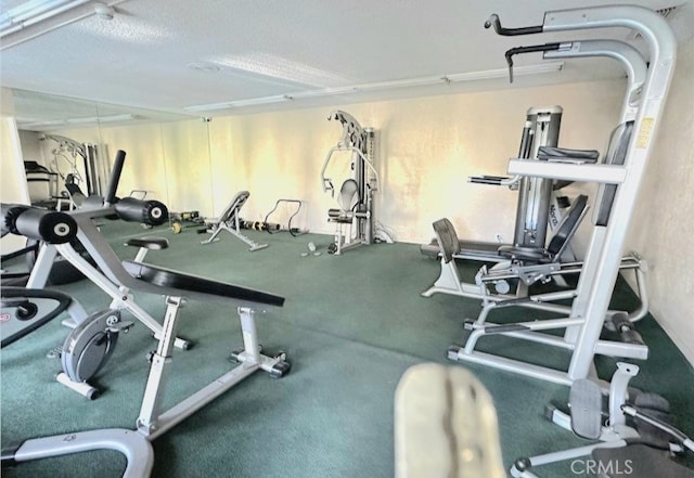 workout area with a textured ceiling